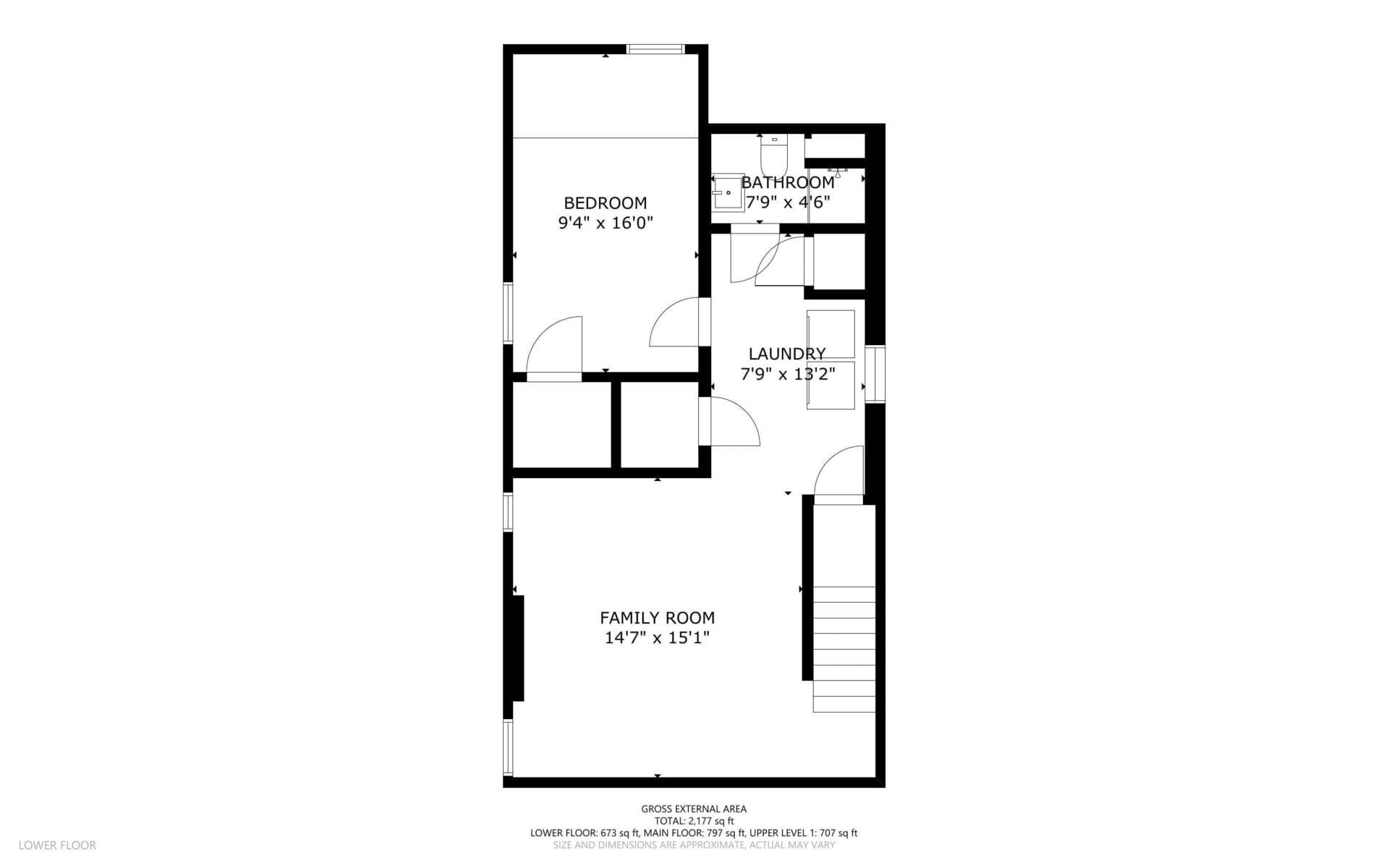 Black and white floor plan showing a lower floor with a family room, bedroom, bathroom, and laundry area, along with door placements and room dimensions labeled in feet and inches.